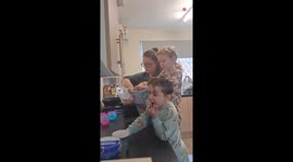 Little baker's impromptu bite adds spice to family baking