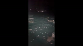 Shocking footage shows sea of sharks slithering in packs
