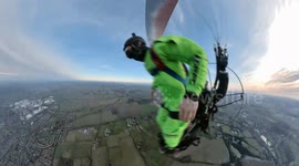 Thrilling footage of BASE jumper diving off paramotor