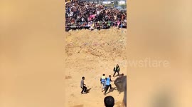 Raging bull gores staff member at festival in China