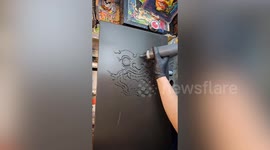 Artist draws Thai monkey god image on pancake