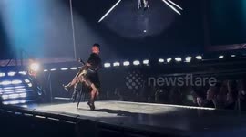 Madonna falls off chair during Celebration tour performance