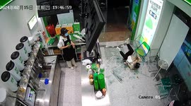 Chinese man runs into shop's glass door, shattering it to pieces