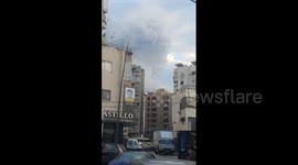 Smoke rises from Lebanon's Sidon as Israel strikes weapon depots