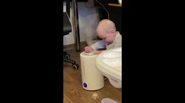 Child's curiosity: playing with the humidifier mist