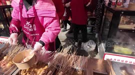 People enjoy food in Xian, China
