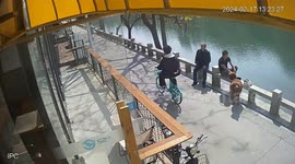 Man tumbles into river after getting startled by his golden retriever that brushed againsthim