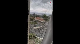 Woman finds her room window cracked and sees it fall apart after a touch