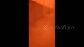 China: Surroundings Turn Eerie Orange As Severe Sandstorm Shrouds Xinjiang