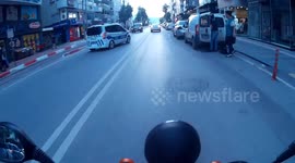 Motorcycle rider collides with police car in Antalya, Turkey