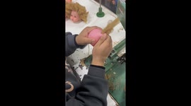 Dollmaker Sews On Curly Hair