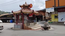 This tiny temple in Malaysia also serves as a quirky roundabout for motorists