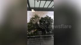 Indonesia tornado carries debris through streets