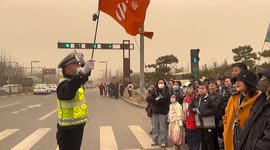 Chinese traffic officers' innovative leadership safely guides tourists through busy streets