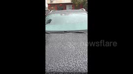 Freezing rain blankets car in central China