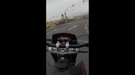 Failed wheelie: motorcyclist brushes off fall and rides on