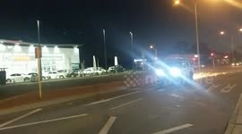 Motorist uses train crossing to escape police like in scene from an action film