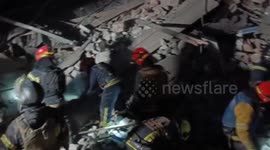 Emergency services search through rubble for survivors after Russia strikes building in Kramatorsk