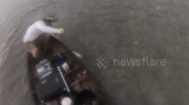 Fisherman gets dragged out of canoe by shark they had just caught