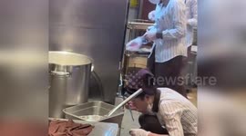 Restaurant employee causes online stir for sticking used chopsticks in pot of noodles