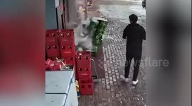 Dramatic moment icicles from drain pipe smash dozens of beer bottles outside restaurant