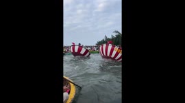Hundreds of tourists enjoy the unique basket boat dance performance on the River in Vietnam