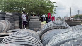 Tanzanian man earns living by making sandals from used tires