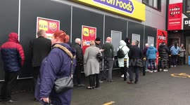 CHEAP AS CHIPS! Hundreds of people queue for hours to buy fish and chip meal for 75p instead of £5.70
