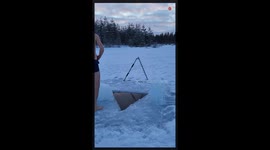 Adventurous Man takes a bath and dip in Frozen Lake Water *Ice Bath*