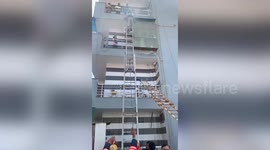 Firefighters rescue trapped residents after blaze rips through house in northern India