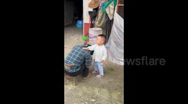 Brave toddler cares for fallen grandmother and alerts grandfather during kitchen fire crisis