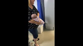 Cute toddler holds his newborn baby brother for the first time *Heartwarming*