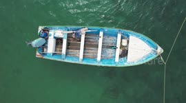 View of a panga or fishing boat diving into the water of the bay or beach in the La Manga fishing community in San Carlos, Sonora Mexico. Municipality of Nuevo Guaymas Mexico.