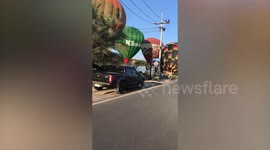 Hot air balloons prepare for take-off in Thailand