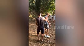 Oddly terrifying moment HUGE spider clings onto Canadian tourist's back