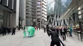 Climate activists perform classic dance protest against insurance company in London