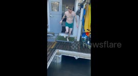 Unconventional workplace challenge leads to daring dive in crab tank