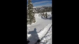 Skier cautiously navigates steep cliff in California