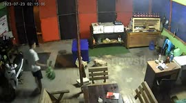 Pickup truck crashes through shop's kitchen and narrowly misses cook