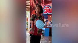 Schoolgirl shrieks as she is terrified of popping balloon for science show