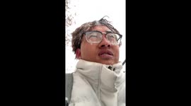 Chinese man's epic blizzard ride leaves him with frozen hairstyle