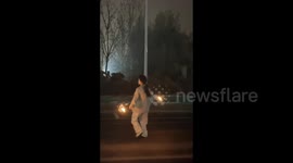 A dancer holding sparklers in Handan, China