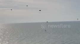 Palestinians fish supplies out of sea after Jordan airdrops packages to Gaza