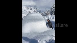 Car owners in northwestern China navigate blind searches for buried vehicles in heavy snow