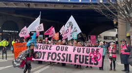 London, UK. 28 FEB, 2024.  Members of Extinction Rebellion create a human chain around Lloyds of London to demand insurers to halt support for climate-damaging projects. Urging immediate cessation of coverage for new fossil fuel ventures, respecting human