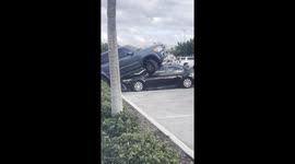 Florida man topples car with SUV in Walmart parking lot
