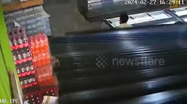 Powerful storm blows open shutter doors and sends employee flying in Thailand