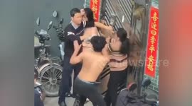 Father caught cheating with son's young girlfriend sparking street fight with whole family