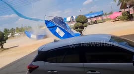 Dust devil tornado blows over tent
