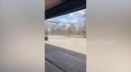 Woman screams while watching dust devil tornado tear through car park